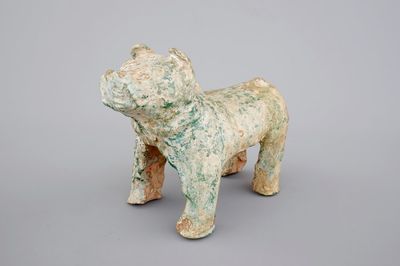 A Chinese green glazed pottery figure of a dog, presumably Han Dynasty