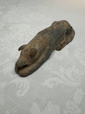 A Chinese grey pottery model of a reclining dog, Han — photo 1
