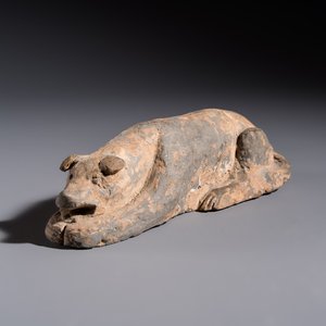 A Chinese grey pottery model of a reclining dog, Han — photo 1