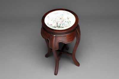 A Chinese hardwood stand with a mounted famille rose plaque, Republic