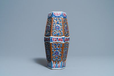 A Chinese hexagonal blue, white and copper-red brown-ground vase, 19th C.