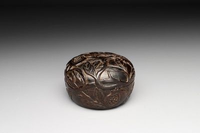 A Chinese huanghuali wooden box and cover with pomegranate design, 17/18th C.
