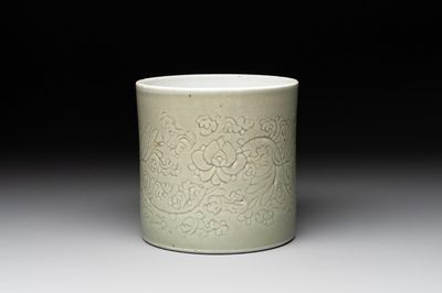 A Chinese incised celadon-glazed 'lotus scroll' brush pot, Kangxi