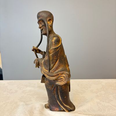 A Chinese inscribed lacquered gilt-bronze figure of a luohan — photo 5