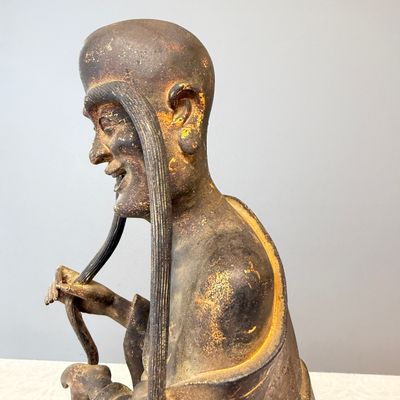 A Chinese inscribed lacquered gilt-bronze figure of a luohan — photo 6
