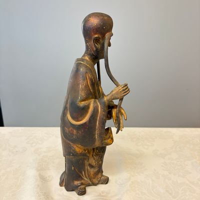 A Chinese inscribed lacquered gilt-bronze figure of a luohan — photo 16