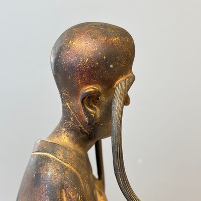 A Chinese inscribed lacquered gilt-bronze figure of a luohan — photo 17