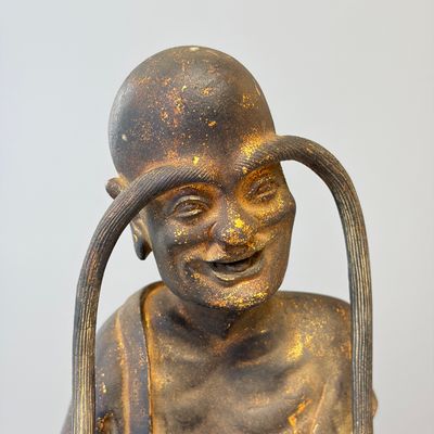 A Chinese inscribed lacquered gilt-bronze figure of a luohan — photo 2