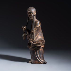 A Chinese inscribed lacquered gilt-bronze figure of a luohan — photo 3