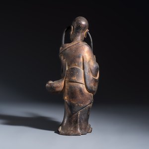 A Chinese inscribed lacquered gilt-bronze figure of a luohan — photo 4