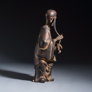 A Chinese inscribed lacquered gilt-bronze figure of a luohan — photo 5