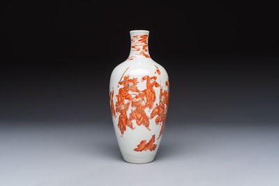 A Chinese iron-red and gilt-decorated vase with a narrative design, Qianlong mark, 19th C.