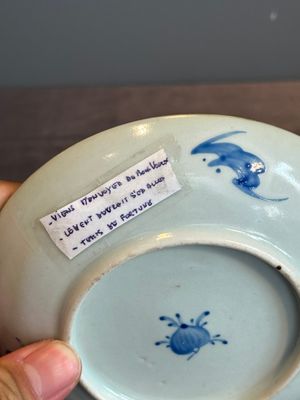 A Chinese iron-red 'bat' saucer and a black-glazed 'ship' saucer with calligraphy, Guangxu mark, 19th C. — photo 21