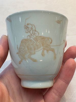 A Chinese iron-red-decorated 'boy and buffalo' cup and saucer and a famille rose 'Xi Xiang Ji' cup and saucer, Qianlong — photo 1