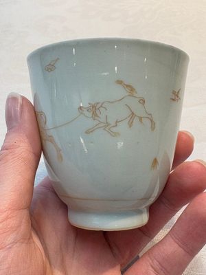 A Chinese iron-red-decorated 'boy and buffalo' cup and saucer and a famille rose 'Xi Xiang Ji' cup and saucer, Qianlong — photo 2