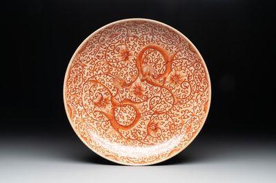 A Chinese iron-red-decorated crackle-glazed 'chilong and lotus scroll' plate, Jiajing mark, 19th C.