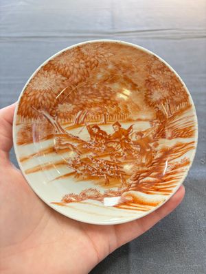 A Chinese iron-red-decorated 'Deer Hunting' cup and saucer, Qianlong — photo 1