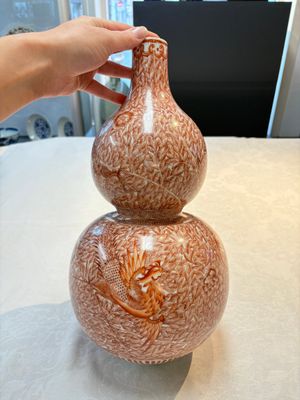 A Chinese iron-red-decorated 'dragon and phoenix' double-gourd vase, Qianlong mark, Republic — photo 1