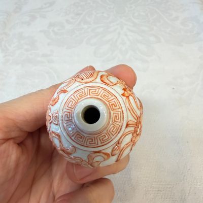 A Chinese iron-red-decorated relief-moulded 'An Ba Xian 暗八仙' snuff bottle — photo 5