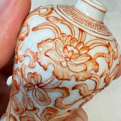 A Chinese iron-red-decorated relief-moulded 'An Ba Xian 暗八仙' snuff bottle — photo 10