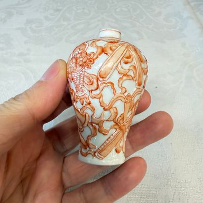 A Chinese iron-red-decorated relief-moulded 'An Ba Xian 暗八仙' snuff bottle — photo 4