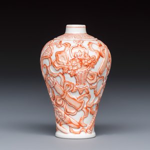 A Chinese iron-red-decorated relief-moulded 'An Ba Xian 暗八仙' snuff bottle — photo 2