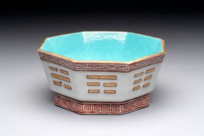 A Chinese iron-red gilt-decorated octagonal 'trigrams' bowl, Tongzhi mark and of the period