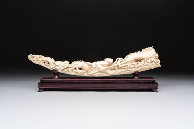 A Chinese ivory carving depicting a Luohan and a dragon, 'Da Ming 大明' mark, 19/20th C.
