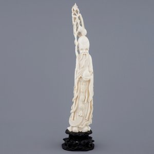 A Chinese ivory figure of Shou Lao on stand, late 19th C. — photo 2