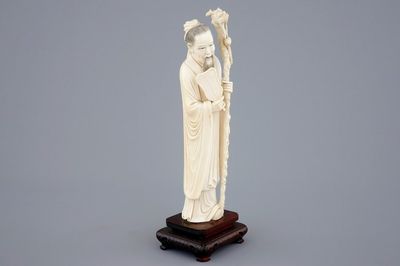 A Chinese ivory figure of Zhongli Quan on stand, late 19th C.