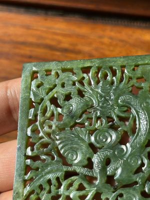 A Chinese jade 'dragon' plaque, a 'double-happiness' plaque and a jade inset silver brooch, 19th C. — photo 18