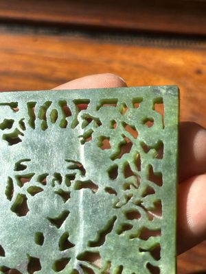 A Chinese jade 'dragon' plaque, a 'double-happiness' plaque and a jade inset silver brooch, 19th C. — photo 21
