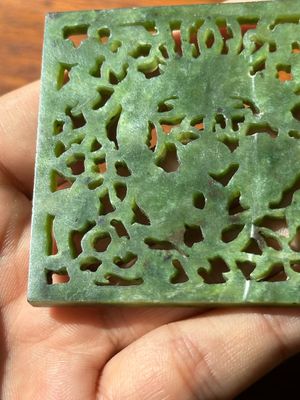 A Chinese jade 'dragon' plaque, a 'double-happiness' plaque and a jade inset silver brooch, 19th C. — photo 23
