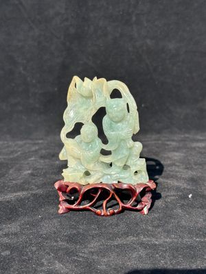 A Chinese jade 'He He Er Xian' group on wooden stand, 19th C. — photo 1