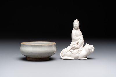 A Chinese 'jun' bowl and a Dehua blanc de Chine group with Guanyin, Ming/Qing