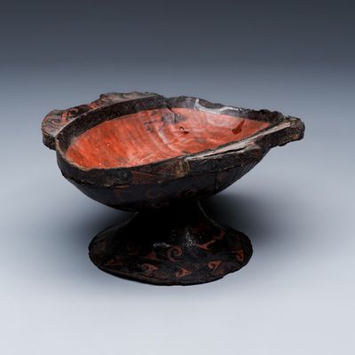 A Chinese lacquered stem cup with two handles, Warring States period