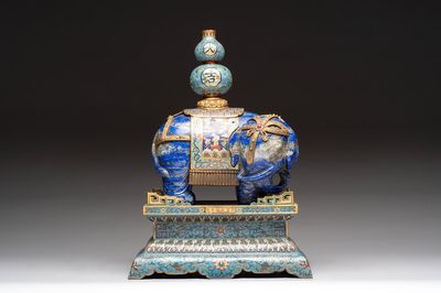 A Chinese lapis lazuli and cloisonné elephant on stand, 19/20th C.