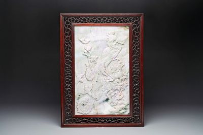 A Chinese lavender and green jadeite 'phoenix' plaque in a hongmu frame, early 20th C.