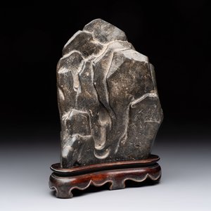 A Chinese Lingbi stone scholar's rock on wooden stand, Yun Tai 雲台 mark, 19/20th C. — photo 1