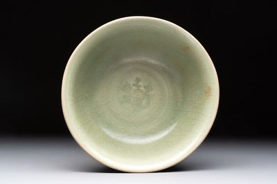 A Chinese Longquan celadon bowl with floral anhua design, Ming