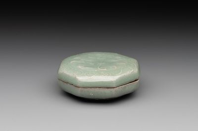 A Chinese Longquan celadon box and cover with anhua peony design, Song