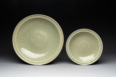 A Chinese Longquan celadon dish and a plate with floral design, Ming