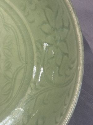 A Chinese Longquan celadon dish with floral design, Ming — photo 4