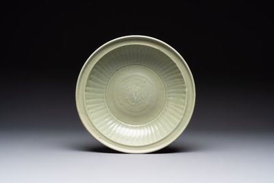 A Chinese Longquan celadon plate with floral design, Yuan/Ming