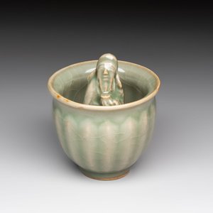 A Chinese Longquan celadon 'Trick Cup', Ming or later — photo 1