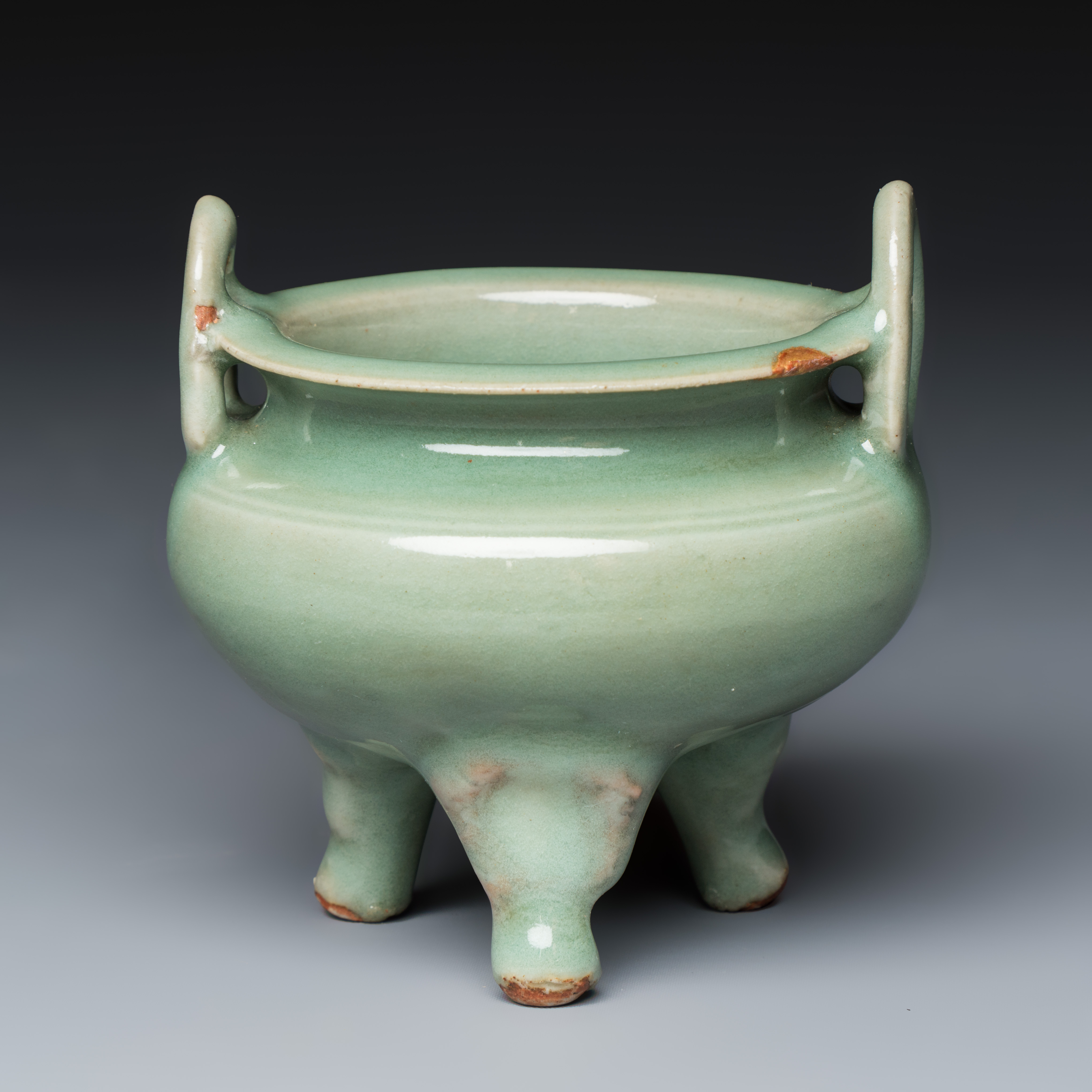 A Chinese Longquan celadon tripod censer with handles — photo 1