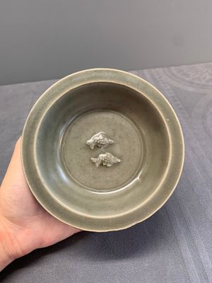 A Chinese Longquan celadon 'twin fish' dish and two 'twin fish' saucers, Yuan/Ming — photo 4