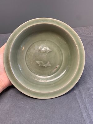 A Chinese Longquan celadon 'twin fish' dish and two 'twin fish' saucers, Yuan/Ming — photo 6