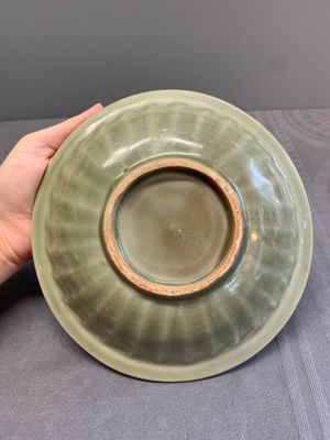 A Chinese Longquan celadon 'twin fish' dish and two 'twin fish' saucers, Yuan/Ming — photo 7