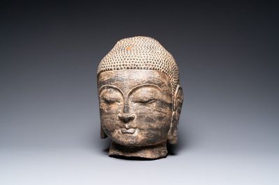 A Chinese Ming-style carved stone head of Buddha, 19/20th C.